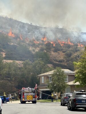 Firefighters respond to a small brush fire near the intersection of Barcelona Road and Capri Court in Castaic on Sunday. Katherine Quezada/The Signal