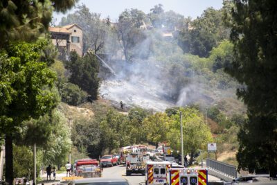 The Los Angeles County Fire Department responded to a brush fire in Newhall that damaged structures on Saturday. Habeba Mostafa/ The Signal