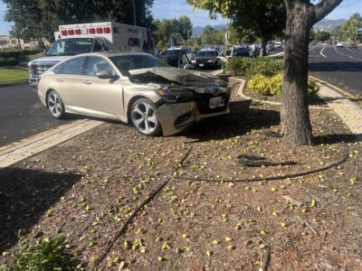 One person was injured when a gold sedan struck a tree Monday morning. Perry Smith/The Signal