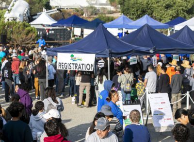 Over 1,100 volunteers show up on Saturday morning, Sept. 21, 2024, at the William S. Hart Pony Baseball and Softball Complex for the 29th annual River Rally Cleanup and Environmental Expo. Habeba Mostafa/The Signal