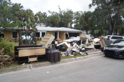 Debris piles up in front of Aubree and Austin Figler’s home on Sept. 29, 2024, after it endured more than three feet of flooding during Hurricane Helene. Photo by T.J. Muscaro.