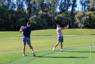 Golfer Yazan Ammari (L) and financial consultant at Logix Financial Services, John Janios (R) practice their swings at the Santa Clarita Valley Chamber of Commerce 40th annual golf tournament Monday morning at the Valencia Country Club. 093024 Maya Morales/The Signal