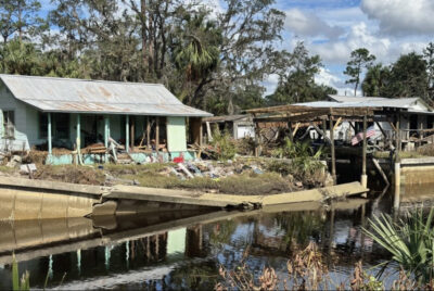 The contents of a home that was in the path of Hurricane Helene lie strewn across the porch and yard in Suwannee, Fla., on Oct. 5. Photo by Nanette Holt.