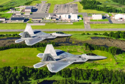 Two U.S. Air Force F-22 Raptors fly over Joint Base Langley-Eustis, on June 14, 2018. Photo by Tech. Sgt. Natasha Stannard/U.S. Air Force.