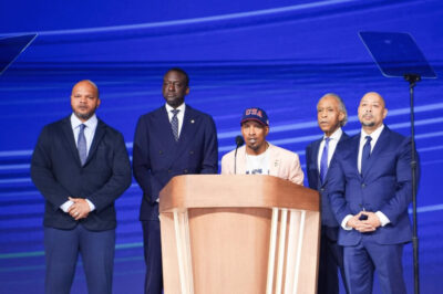 Activist from “The Central Park Five,” Korey Wise (C), speaks on stage alongside (L-R) activist Kevin Richardson, New York City Council Member Dr. Yusef Salaam, and activist Raymond Santana, accompanied by Rev. Al Sharpton (2nd-R), on the last day of the Democratic National Convention in Chicago on Aug. 22, 2024. Photo by Madalina Vasiliu.