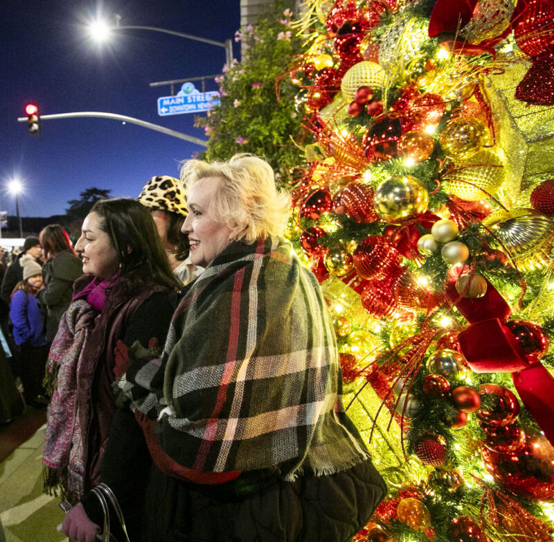 Residents enjoy the newly lit tree, which marks the beginning of the holiday season in Santa Clarita, during Light Up Main Street in Old Town Newhall on Saturday, Nov. 16, 2024. Habeba Mostafa/ The Signal