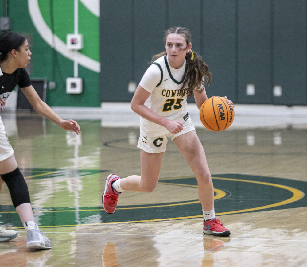 File photo of Canyon sophomore, then-freshman Darby Dunn (25) dribbling the ball during the first quarter of Tuesday's game against Saugus at Canyon High School on Dec. 3. Habeba Mostafa/ The Signal