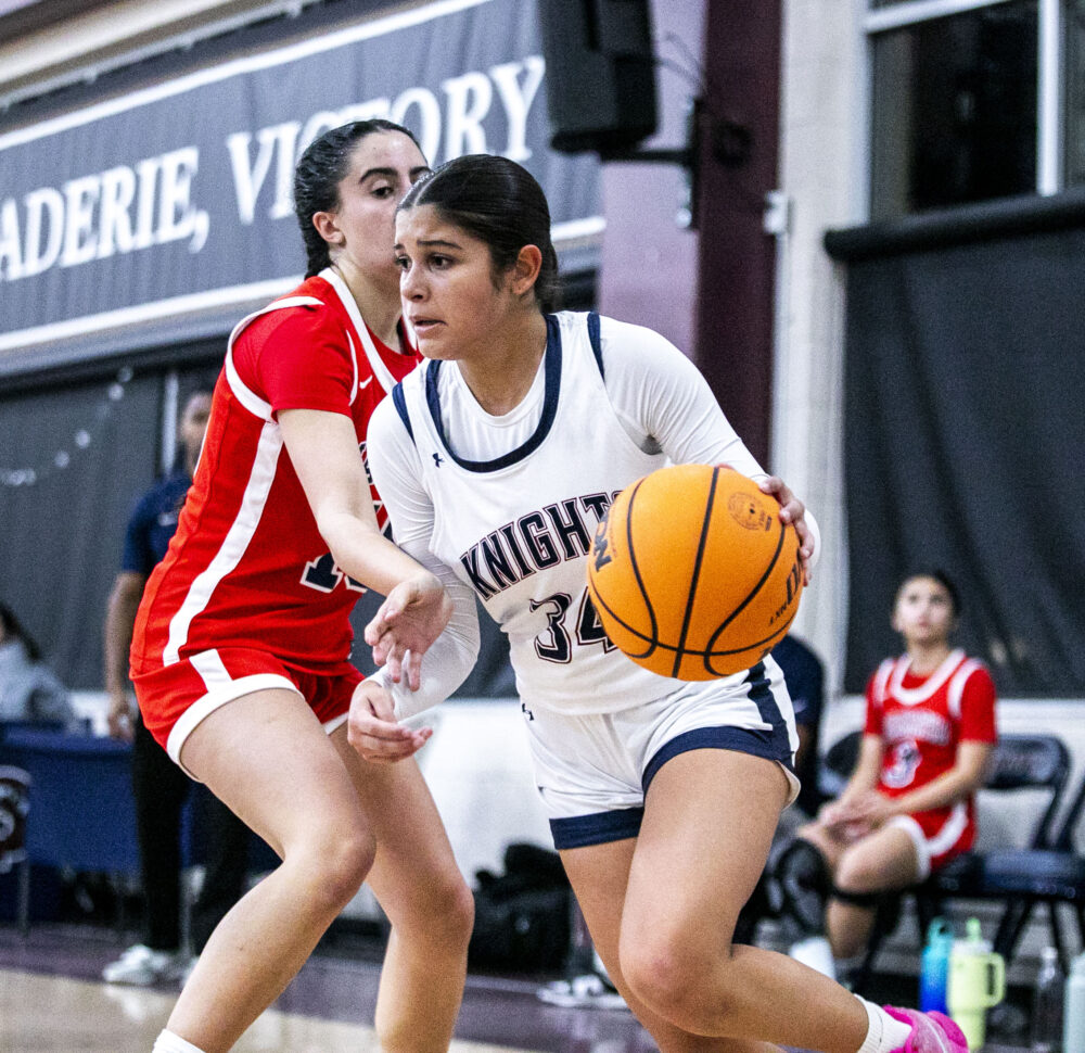 Trinity freshman Noa Peña (34) dribbles the ball past Maranatha guard Aleen Avannessian (15) during Thursday's game at Church of the Nazarene on Dec. 5. Habeba Mostafa/ The Signal