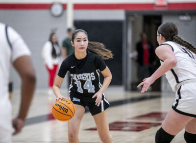 Saugus shooting guard Jasmine Garcia (14) dribbles the ball past Hart defense during the second quarter of Friday's game at Hart High School on Dec. 13. Habeba Mostafa/ The Signal