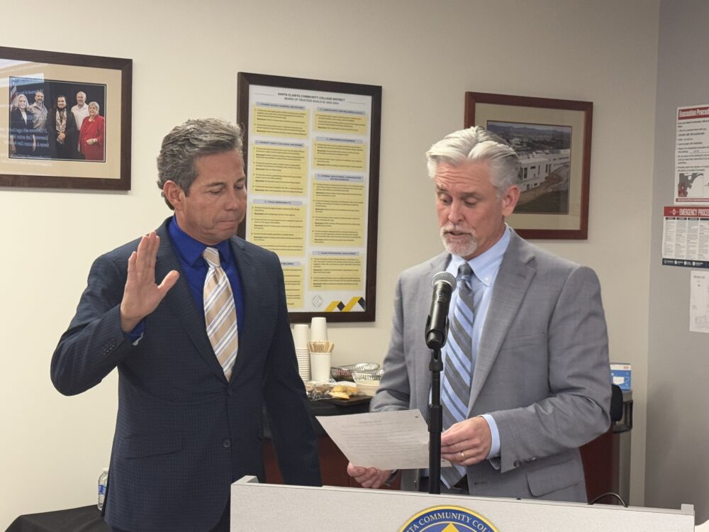 COC interim president David Andrus (right) swears in governing board member Fred Arnold during Wednesday's meeting at the COC University Center on Dec. 18, 2024. Tyler Wainfeld/The Signal.