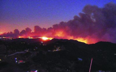 This camera feed from L.A. County Fire Department Helibase 69 Bravo shows the Palisades Fire as it burns out of control on Tuesday, Jan. 7, 2025. Photo: ALERTCalifornia.