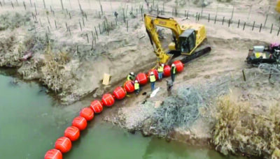 Video footage shows Texas workers installing a barrier made of buoys in the Rio Grande at its border crossing area. Screenshot from video posted by Texas Gov. Greg Abbott via X.
