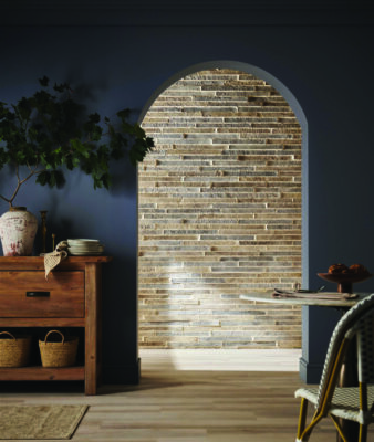 A new design trend, using weathered stone and brick, is to bring that normally outdoor lock inside.