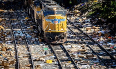 Torn open boxes line train tracks outside of downtown Los Angeles after reoccuring railway robberies on Jan. 14, 2022. Photo by John Fredricks.