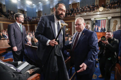 Rep. Al Green (D-Texas) is removed from the chamber as President Donald Trump addresses a joint session of Congress at the U.S. Capitol on March 4, 2025. Win McNamee/Pool Photo via AP