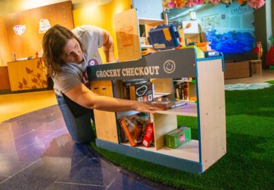 Kari McCoy, president of the LEAP Children’s Museum, reorganizes the items with the assistance of other volunteers for the next group of children on June 7, 2025 at the Valencia Town Center mall in Santa Clarita, Calif. Katherine Quezada/The Signal