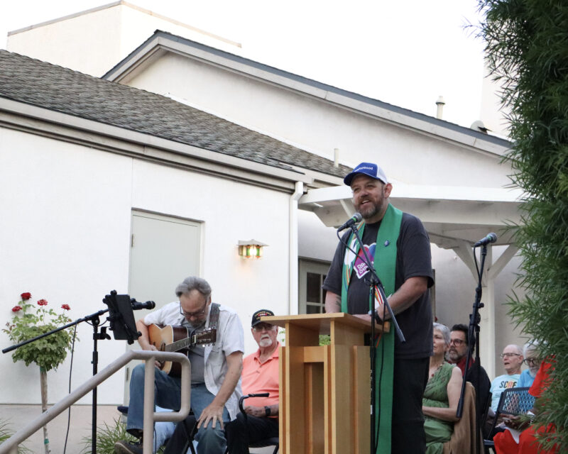 Andy Mattick, pastor at Valencia United Methodist Church, says a prayer for the group at the Good Trouble Interfaith Vigil at Valencia United Methodist Church in Valencia, Thursday, July 17, 2025. Kamryn Martell/The Signal