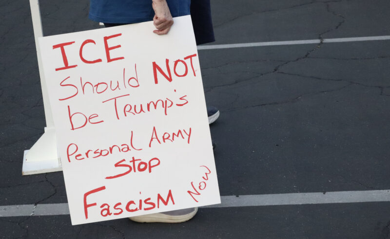 Attendees hold signs for the Good Trouble Interfaith Vigil at Valencia United Methodist Church in Valencia, Thrsday, July 17, 2025. Kamryn Martell/The Signal