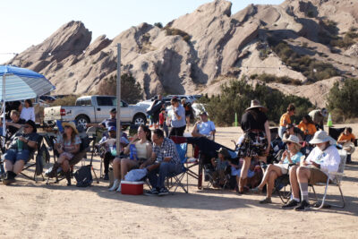 Attendees sit and listen to Western musicians play on stage at the Celebration of Western Songs at Vasquez Rocks in Agua Dulce, Sunday, July 13, 2025. Kamryn Martell/The Signal