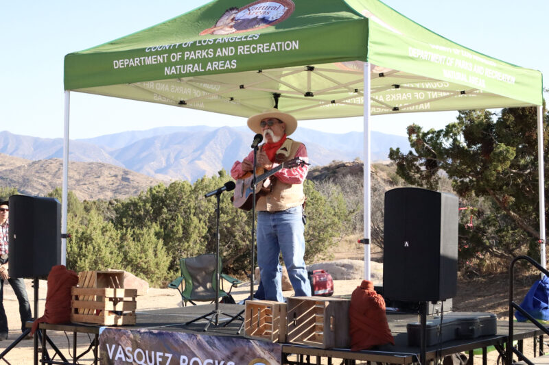 Western singer Michael Tcherkassky plays his guitar and sings a traditional Western song to the audience  at the Celebration of Western Songs at Vasquez Rocks in Agua Dulce, Sunday, July 13, 2025. Kamryn Martell/The Signal