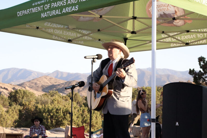 Bryan Marr, or "Buffalo Bryan," sings to the audience at the Celebration of Western Songs at Vasquez Rocks in Agua Dulce, Sunday, July 13, 2025. Kamryn Martell/The Signal