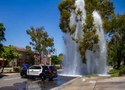 A two vehicle collision shears a fire hydrant near the intersection of Decoro Drive and McBean Parkway in Valencia on July 23, 2025. Katherine Quezada/The Signal