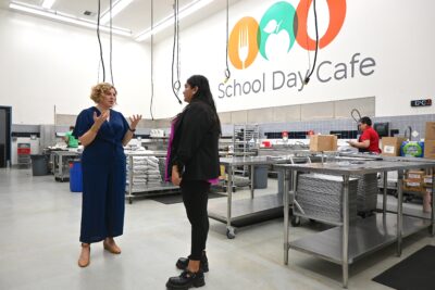Assemblywoman Pilar Schiavo, D-Chatsworth, (left) speaks with Brittany Young of School Day Cafe about operations at the organization’s Anza Drive facility in Valencia, July 23, 2025. Michael Picarella/The Signal