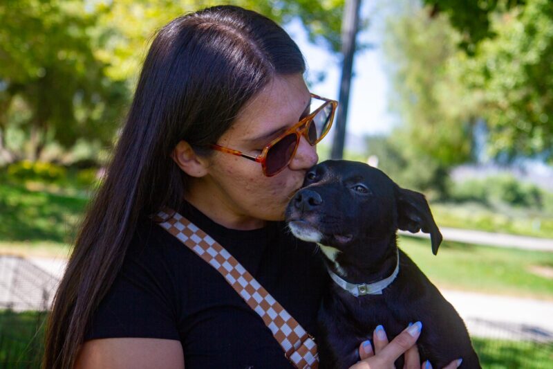 Noelia Sainz gives her new pet a kiss before she takes her home following the pet adoption event at Bridgeport Park on July 24, 2025 in Valencia, Calif. Katherine Quezada/The Signal