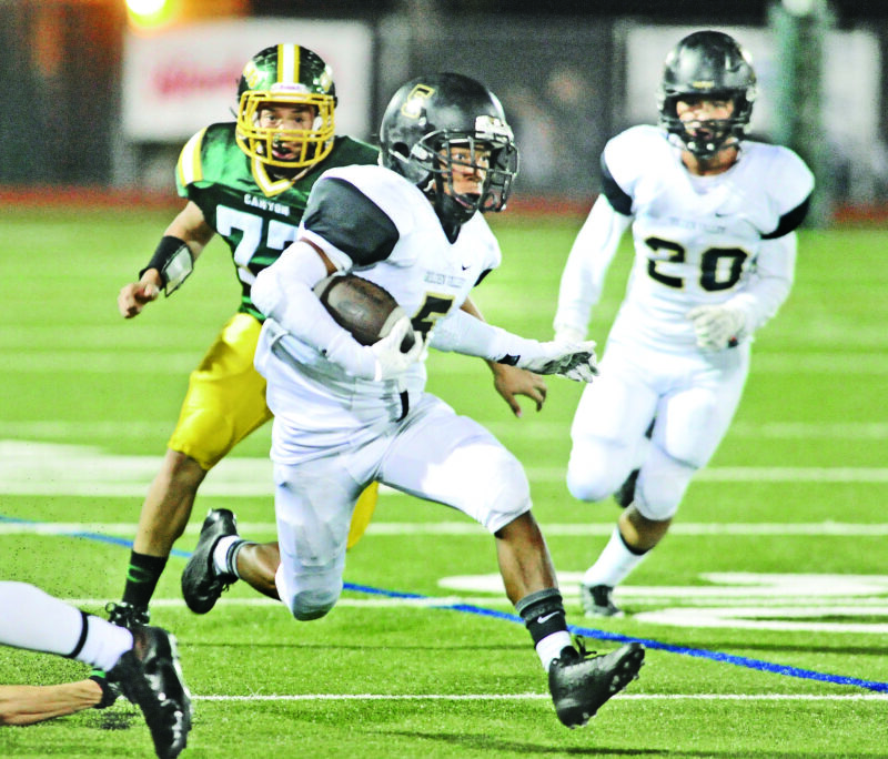 Golden Valley halfback Shane Tamura (5) runs against Canyon on 101714. Dan Watson/The Signal