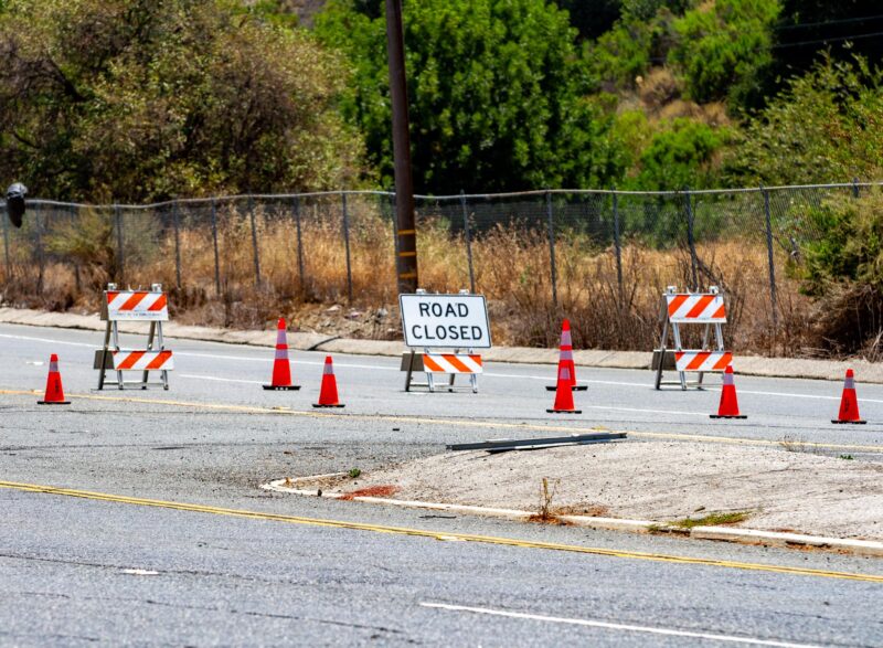 A road closure going south on The Old Road diverts traffic as The California Highway Patrol investigates a fatal traffic collision on Aug. 2, 2025 near Weldon Canyon. Katherine Quezada/The Signal