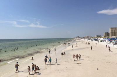 Tourists and locals play in the surf and sand in Clearwater Beach, Fla., on July 2, 2023. Photo by Nanette Holt.