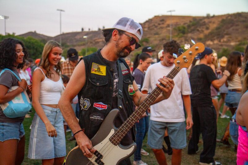 Redneck Rodeo singer Toddy C. Bass joins the crowd as they line dance during the "Concerts in the Park" on Aug. 2, 2025 in Saugus, Calif. Katherine Quezada/The Signal