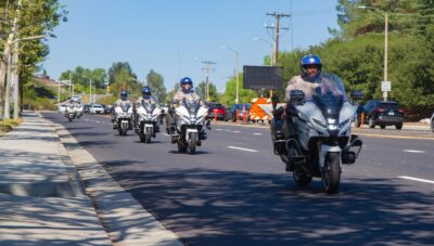 Los Angeles County Sheriff’s Department motorcyclists caravan in honor of Detective Joshua Kelley-Eklund, one of three deputies killed in an explosion in East Los Angeles, before his funeral service on Aug. 7, 2025 at Grace Baptist Church in Saugus, Calif. Katherine Quezada/The Signal