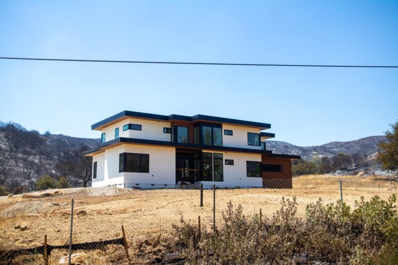 A newly-built home in Hasley Canyon was surrounded by scorched brush from the "Canyon Fire" on Friday, Aug. 8, 2025. Katherine Quezada/The Signal