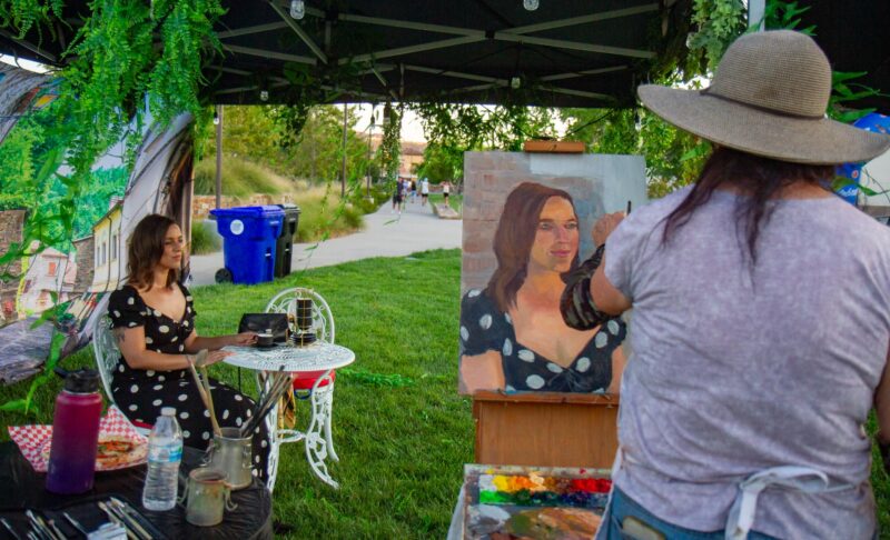 Artist Lorelle Miller (right) creates a live painting with model Casey Miller at the Celebrate culture series: Italy on Aug. 8, 2025 at the Canyon Country Community Center in Canyon Country, Calif. Katherine Quezada/The Signal