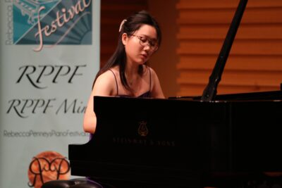 Celine Chen plays piano at the University of South Florida in Tampa, July 2024. Photo courtesy of Christy Sallee