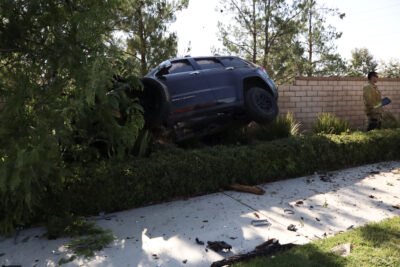 One person in a single vehicle traffic collision crashes into the wall and trees on Camino Del Arte Drive and west Copper Hill Drive, Sunday, Aug. 10, 2025. Kamryn Martell/The Signal
