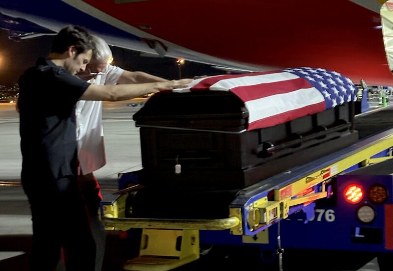 From left: Nick Huff and his father, Ron Huff, welcome the remains of Ron’s father, Edward Schnore, at Harry Reid International Airport in Las Vegas, NV, July 9, 2025. Photo courtesy of Nick Huff.