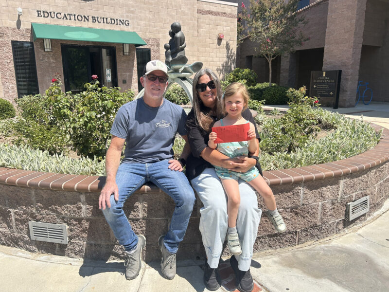 Eloise Burbach, 4, with encouragement from her grandparents Bill and Kelly Phen, donated proceeds from her lemonade stand to Child & Family Center. Courtesy photo.