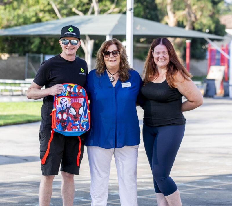 Newhall School District Board Member Suzan Solomon, center, stands with parents Corey and Nicole Noonan on the first day of school at Meadows Elementary School on Thursday, Aug. 14, 2025. Habeba Mostafa/ The Signal
