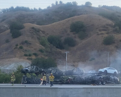 Firefighters tackled a vehicle hauler fire on Interstate 5 near the Balboa Boulevard exit Saturday evening. The truck's cargo — Teslas — presented an additional firefighting challenge. Photo courtesy of Gena Milne.
