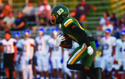 Canyon wide receiver Myles McCrory (23) runs the ball and scores the first touchdown for his team during Friday’s game, Aug. 22, 2025 at Canyon High. Katherine Quezada/The Signal