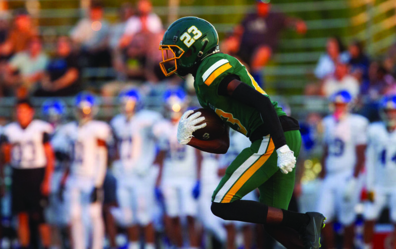 Canyon wide receiver Myles McCrory (23) runs the ball and scores the first touchdown for his team during Friday’s game, Aug. 22, 2025 at Canyon High. Katherine Quezada/The Signal