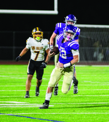 Valencia quarterback Brady Bretthauer (12) runs with the ball during the second quarter of Friday’s game against Simi Valley at Valencia High School on Aug. 22, 2025. Habeba Mostafa/ The Signal