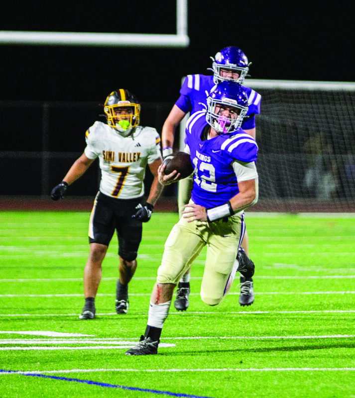 Valencia quarterback Brady Bretthauer (12) runs with the ball during the second quarter of Friday’s game against Simi Valley at Valencia High School on Aug. 22, 2025. Habeba Mostafa/ The Signal