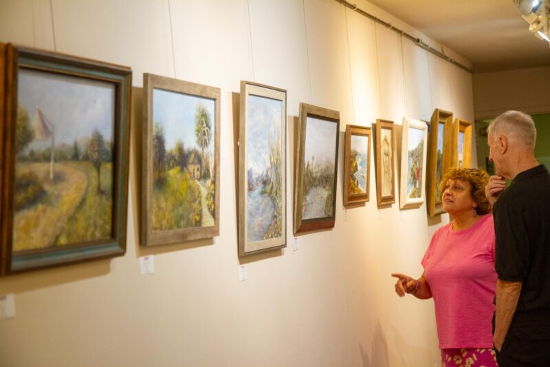 Members of the Santa Clarita Artists Association view Nadia Lusian’s artwork during a special art exhibit held at the Canyon Theatre Guild on Aug. 9, 2025 in Old Town Newhall, Calif. Katherine Quezada/The Signal