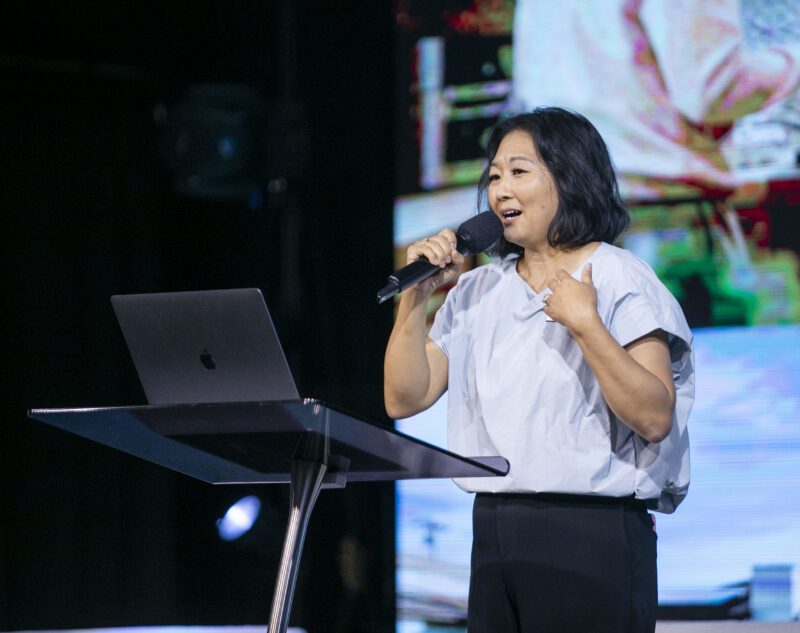 Ester Yu, western regional director for ZOE, speaks to the crowd during the ZOE International Human Trafficking Forum at Elevate Church on Wednesday, Aug. 20, 2025. Habeba Mostafa/ The Signal