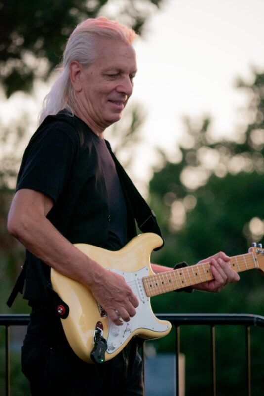Blonde Ambition band guitarist Lyumbomir Radkov performs Madonna’s best hits during “Concerts in the Park” on Saturday Aug. 23, 2025 at Central Park in Saugus, Calif. Katherine Quezada/The Signal