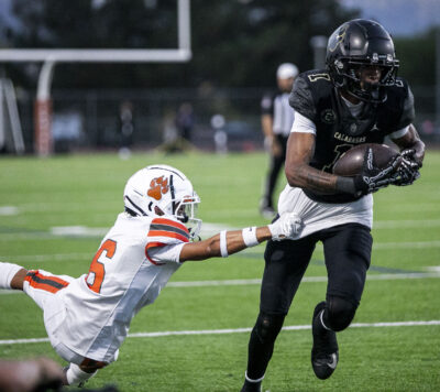 Castaic defensive back Nate Carr (6) tackles Calabasas wide receiver Dezmyn Hardy (1) during the second quarter of Thursday's game at Valencia High School on Aug. 28, 2025. Habeba Mostafa/ The Signal