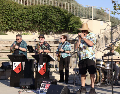 Flat Top Tom and His Jump Cats play blues music for the audience at the Valencia Marketplace Summer Concert Series in Valencia, Friday, Aug. 29, 2025. Kamryn Martell/The Signal
